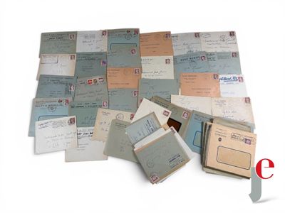 a pile of old letters and envelopes sitting on a table