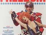 a magazine cover with a woman dressed as a wrestler and a man dressed as a football player