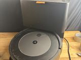 an image of a robot vacuum sitting on top of a wooden table