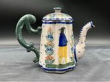 an image of a ceramic teapot with a bird on it