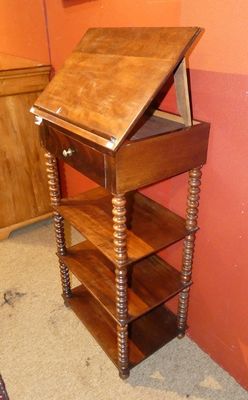 a small wooden table with a book shelf on top of it