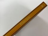 a yellow book sitting on top of a white toilet
