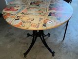 a round table with a pattern on it in the middle of a room
