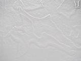 a close up picture of a snowboarder on a snowy surface