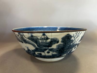 a blue and white bowl sitting on a table