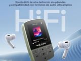 an advertisement for a music player with earphones and headphones in the background