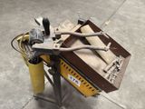 a machine that is sitting on the ground with tools