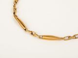 a gold link bracelet with a diamond clasp