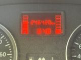 a close up of the dashboard of a car with the time displayed