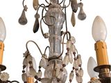 a chandelier that has a lot of lights hanging from it