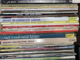 a lot of cds stacked on top of each other