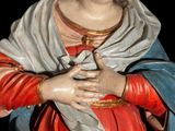 a statue of a woman holding a baby in her arms