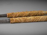 two pens sitting next to each other on a table