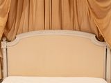 a bed that has a canopy over it in a room