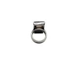 a ring that is sitting on top of a white surface