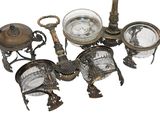a lot of antique items that are sitting on a table