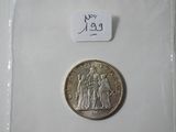a silver coin with a picture of a man and a woman on it