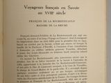 an open book with a black and white image of a bird