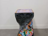 a side table with a colorful design on it
