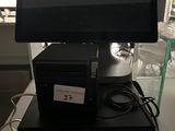 a computer sitting on top of a small black box