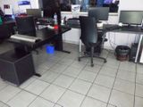 an image of a computer room with a lot of desks