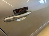 a sticker on the door handle of a car