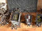 many different pieces of art on the floor next to a fire place