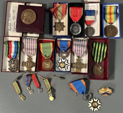 several medals and medals are arranged in a box on a table