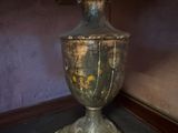 a vase with flowers in it sitting on a table