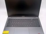 an open laptop computer sitting on top of a white table
