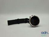 an image of a smart watch sitting on top of a white surface