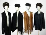 three mannequins dressed in black, brown, and white outfits