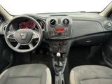 the interior of a small car with a steering wheel and dashboard controls
