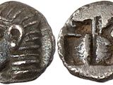 a silver coin with an image of a man and a woman on it