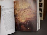 an open book with a picture of a plant on it