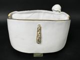 white porcelain bowl with gold trim and a bird on the lid