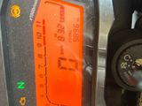 a close up of a gas pump with a clock on it