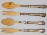 four forks and spoons are lined up on a white surface