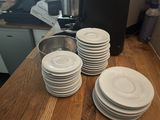 a lot of plates on the counter in the kitchen