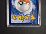 a pokemon trading card with a poke ball on it