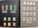 a black book with stamps on it and a black cover