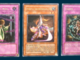 three cards with different designs on them on a blue background