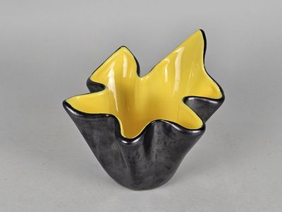 black and yellow ceramic bowl with two fish in the center