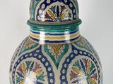 an image of a vase with a lid on a white background