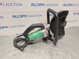 a close up of a machine on a table in front of a wall