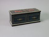 a small blue box with two drawers on top of it