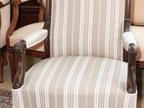 a chair and a chair that are sitting on a rug