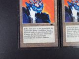 two cards that are sitting on a table