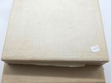 three books stacked on top of each other on a table