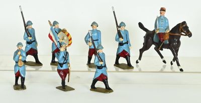 many figurines of men in uniforms riding horses